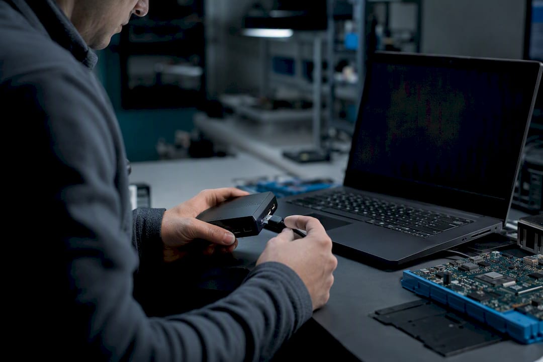 Hands connecting blockchain tracing hardware device